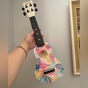 First Act Ukulele with colorful leaves